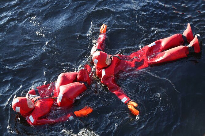 Tromso Arctic Fjord Floating - Warming up at the cabin: waffles, hot drinks, and dry clothes help